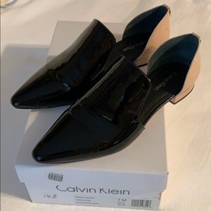 Black shoes with pink back.